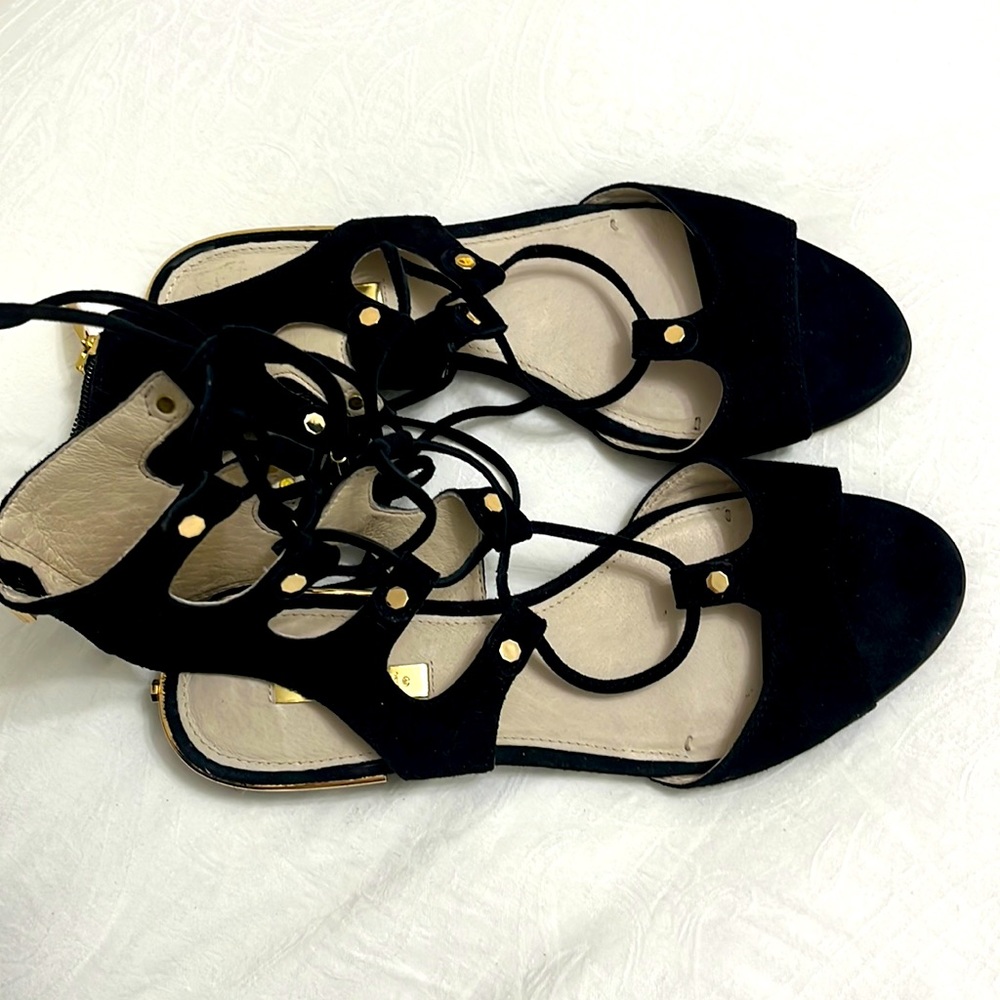Louise et Cie Lo- Ashlyn kid suede lace up sandal; black with gold accents.